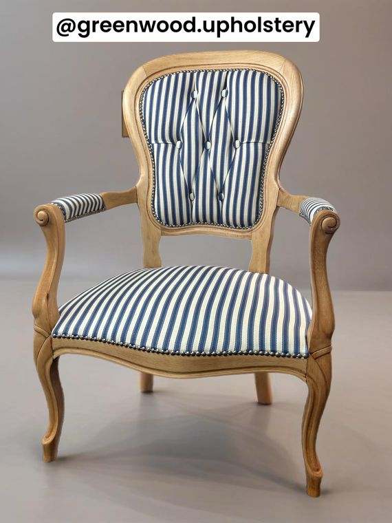 Victorian open armchair, deep-buttoned in blue ticking stripe with stud detail.