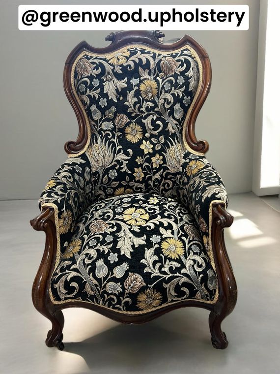 Victorian carved spoon-back chair in a black floral tapestry.