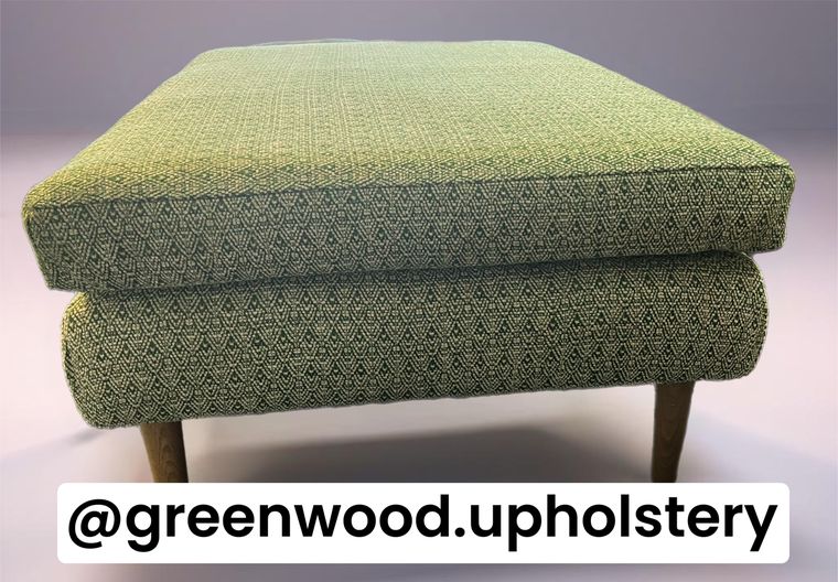 Long bench footstool in a green diamond weave.