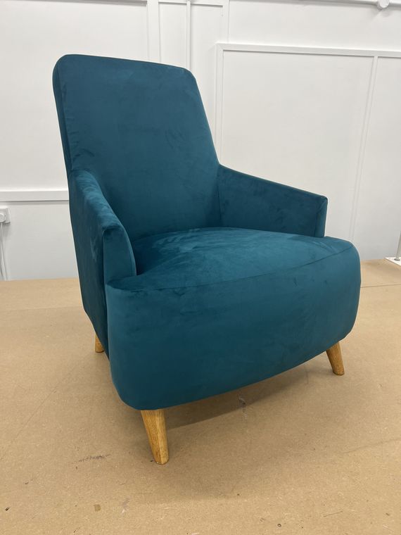 Mid-century armchair in teal velvet.