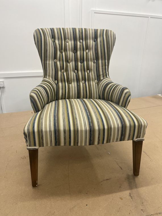 Slipper chair in a blue-and-green stripe.