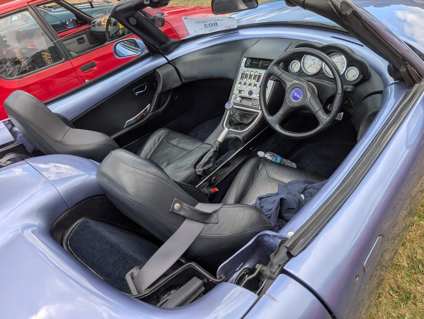 The car at a show on 1 August, roof down and the whole cabin open to view.