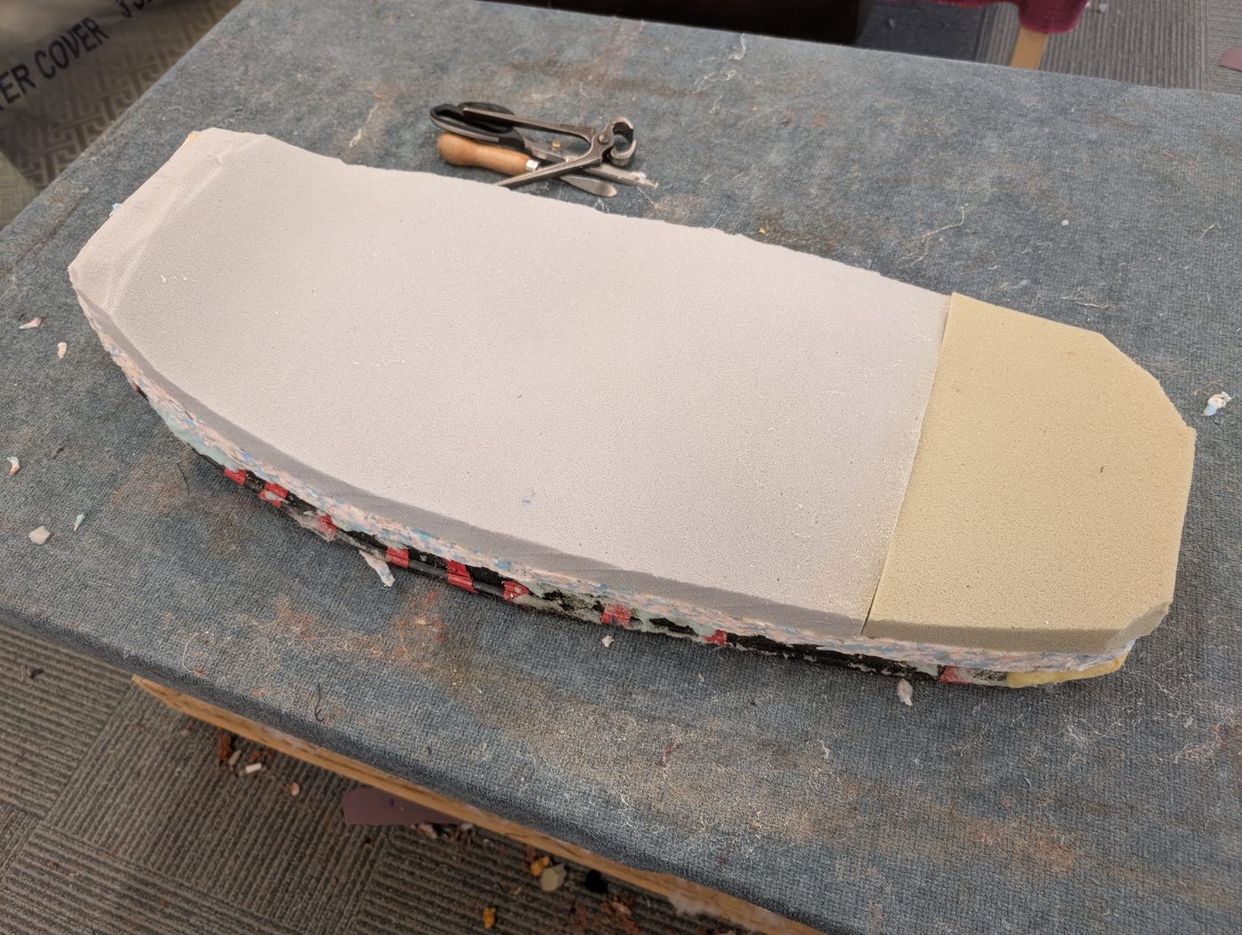 Stripped back and rebuilt with new foam, cut to the flat profile the customer asked for.