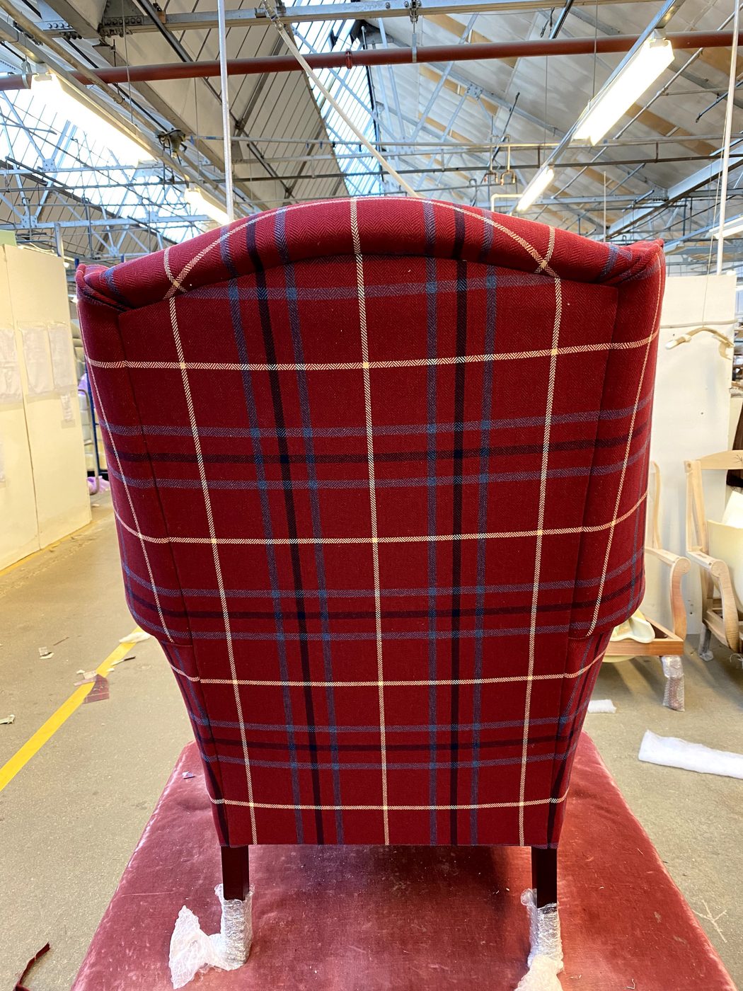 The outside back on — the last big panel, finished clean, with the check centred to match the front.