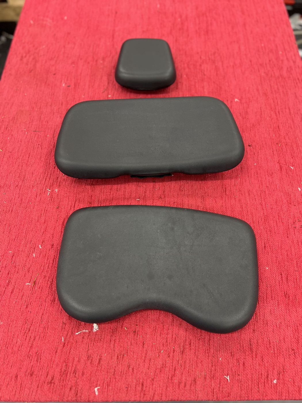 The pads as Renault made them — smooth self-skinned foam, tired and plain.