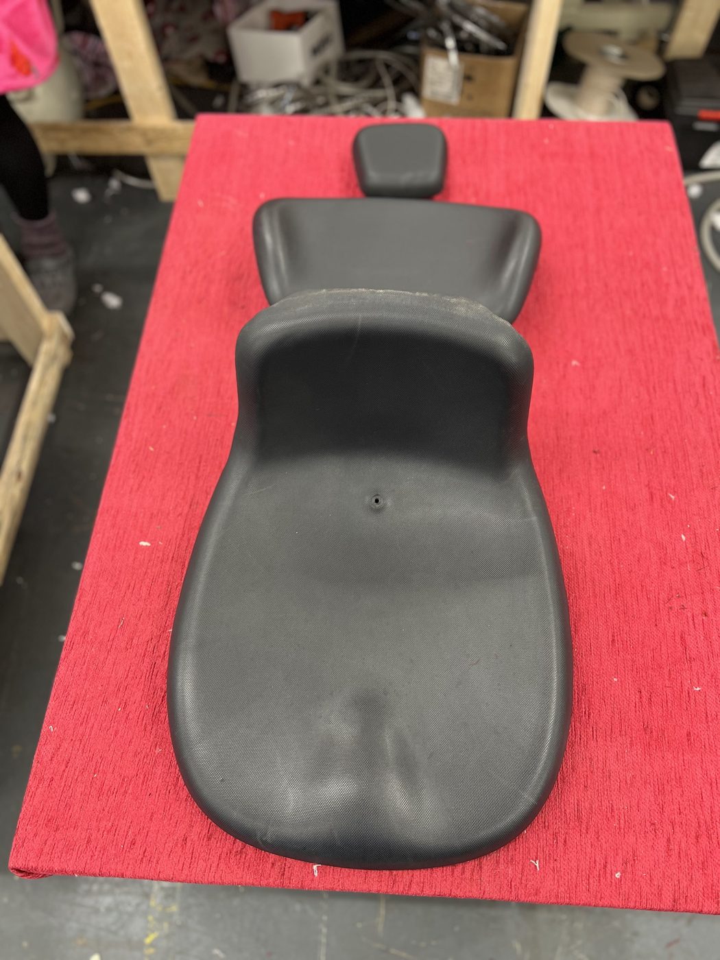 The front seat's one-piece pad — headrest to seat base in a single moulding.