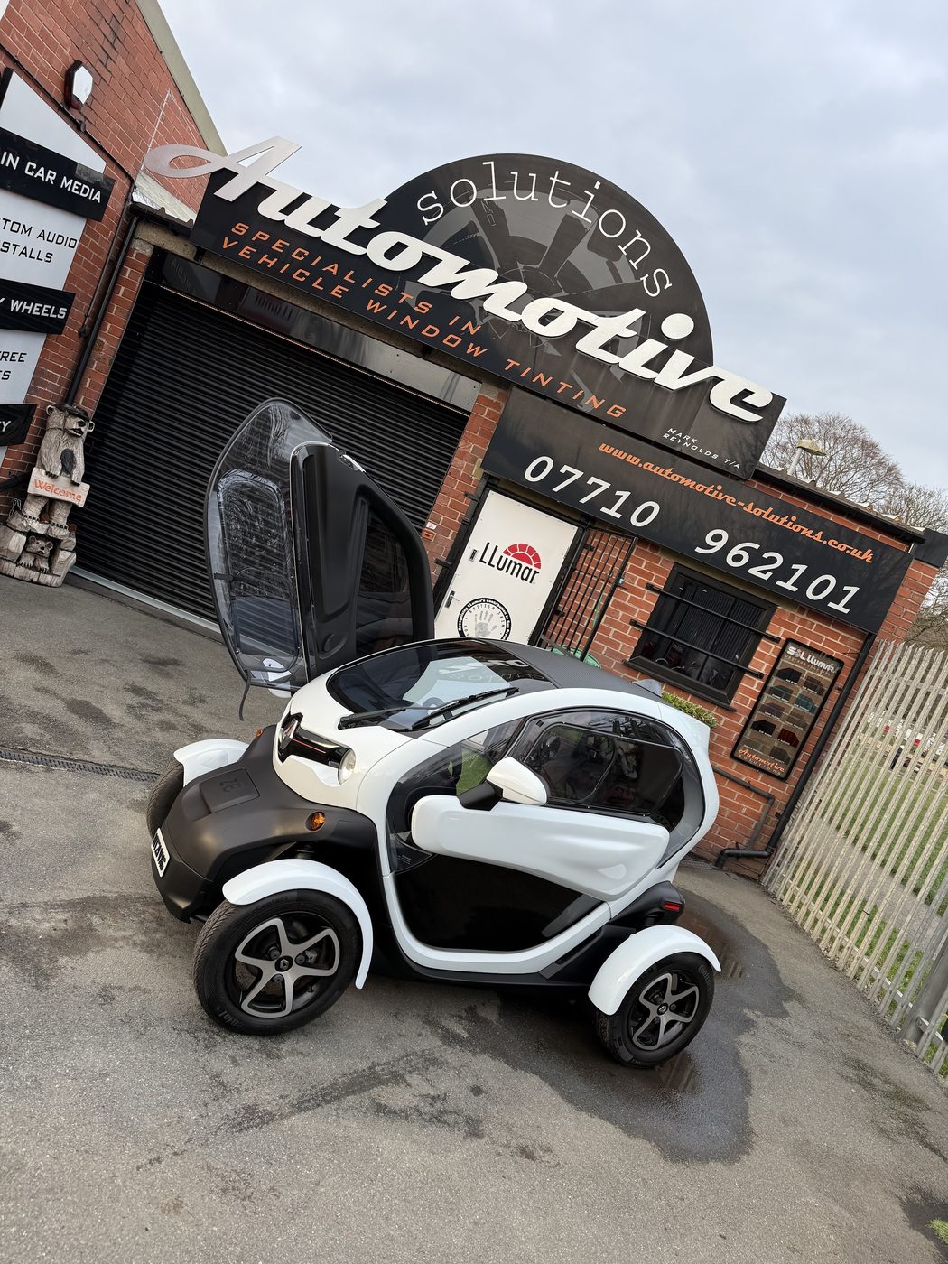 The finished car outside the owner's business — a rolling advert, upgraded.